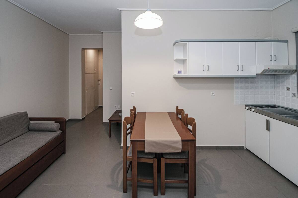 Family Apartment, Garden View | Living area | 40-inch Smart TV with cable channels