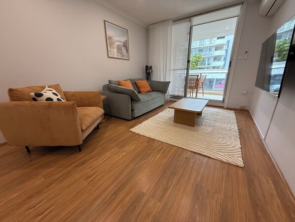Living area - Stylish 2-bed coastal apartment near beach & marina – perfect for relax or work. (Soldiers Point)