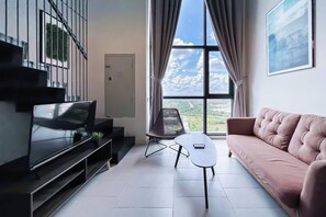 Deluxe Duplex, City View | Living area