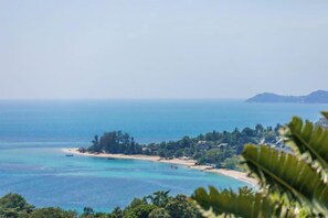 A coastal landscape with a beach, clear blue waters, and a distant island. - Turquoise Villa 2 GYM and KIDS ROOM (Koh Samui)