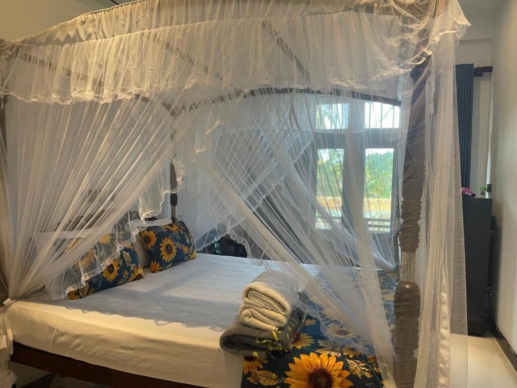 Deluxe tweepersoonskamer, balkon, uitzicht op tuin | Een kluis op de kamer, een bureau, een laptopwerkplek