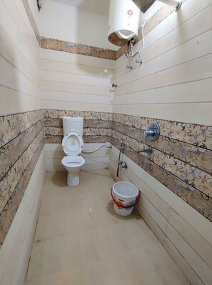 Shower, rainfall showerhead, slippers, towels