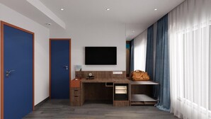 A modern bedroom with a desk, a flat-screen TV, and a large window with curtains. - Zone by The Park New Market Kolkata (Kolkata)