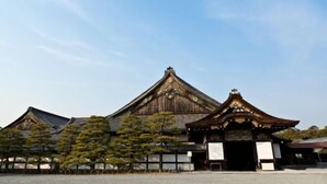 A traditional Japanese building with a prominent entrance and a tiled roof. - Travel time Momotani - 9min walk to Tōgaku Station, 18min walk to Shitennoji Temple (Osaka)