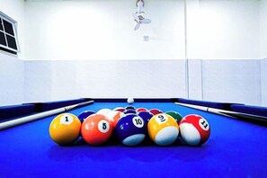 A pool table with numbered balls and a cue stick. - Modern 5-Bedroom House BBQ Event Wedding at Kajang by HCK (Kajang)