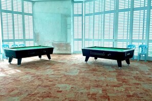 Two pool tables in a room with a patterned floor and large windows. - Macrolink 2B2R 7 pax Condo Medini near legoland (Iskandar Puteri)