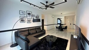 A modern living room with a sofa, coffee table, and artwork on the wall. - Botanika, Shadow Night by Antlerzone (Plentong)