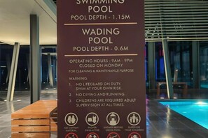 A sign for a swimming pool with a depth of 1.15m and a wading pool with a depth of 0.6m. - Sutera Bay Luxe Haven Suite Infini Stay (Kota Kinabalu)