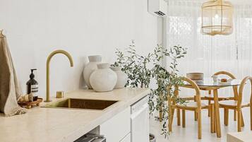 Microwave, dishwasher, coffee/tea maker, dining tables