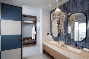 A modern bathroom with a double sink, a large mirror, and a built-in shelf with a towel. - Prime Beach House No. V7 (Sattahip)