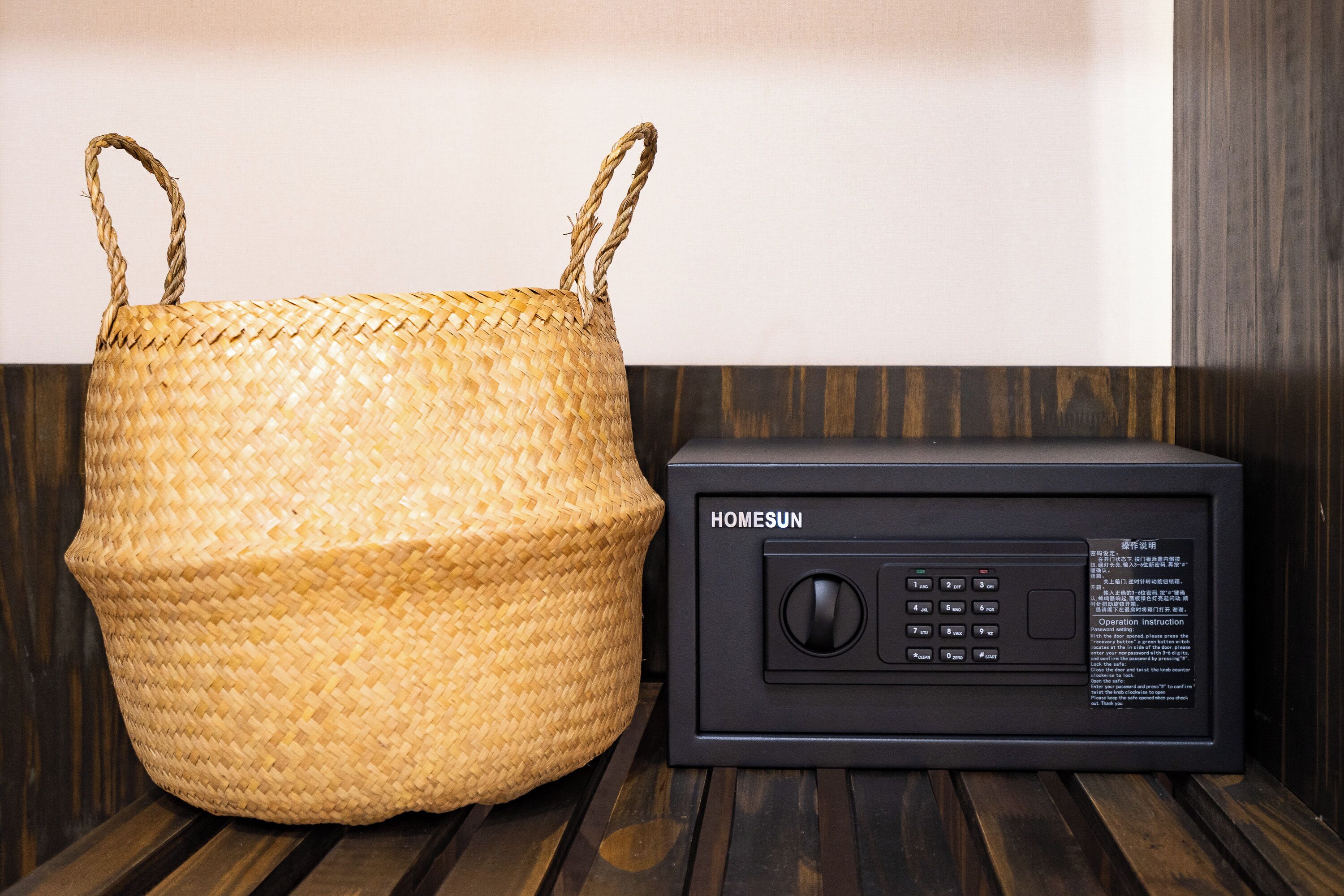 A woven basket and a black electronic device with a control panel and instruction manual.