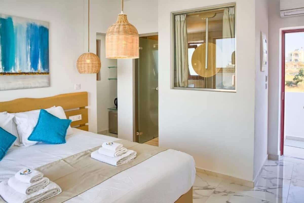 Junior Suite, Balcony, Pool View | In-room safe, desk, soundproofing, free WiFi