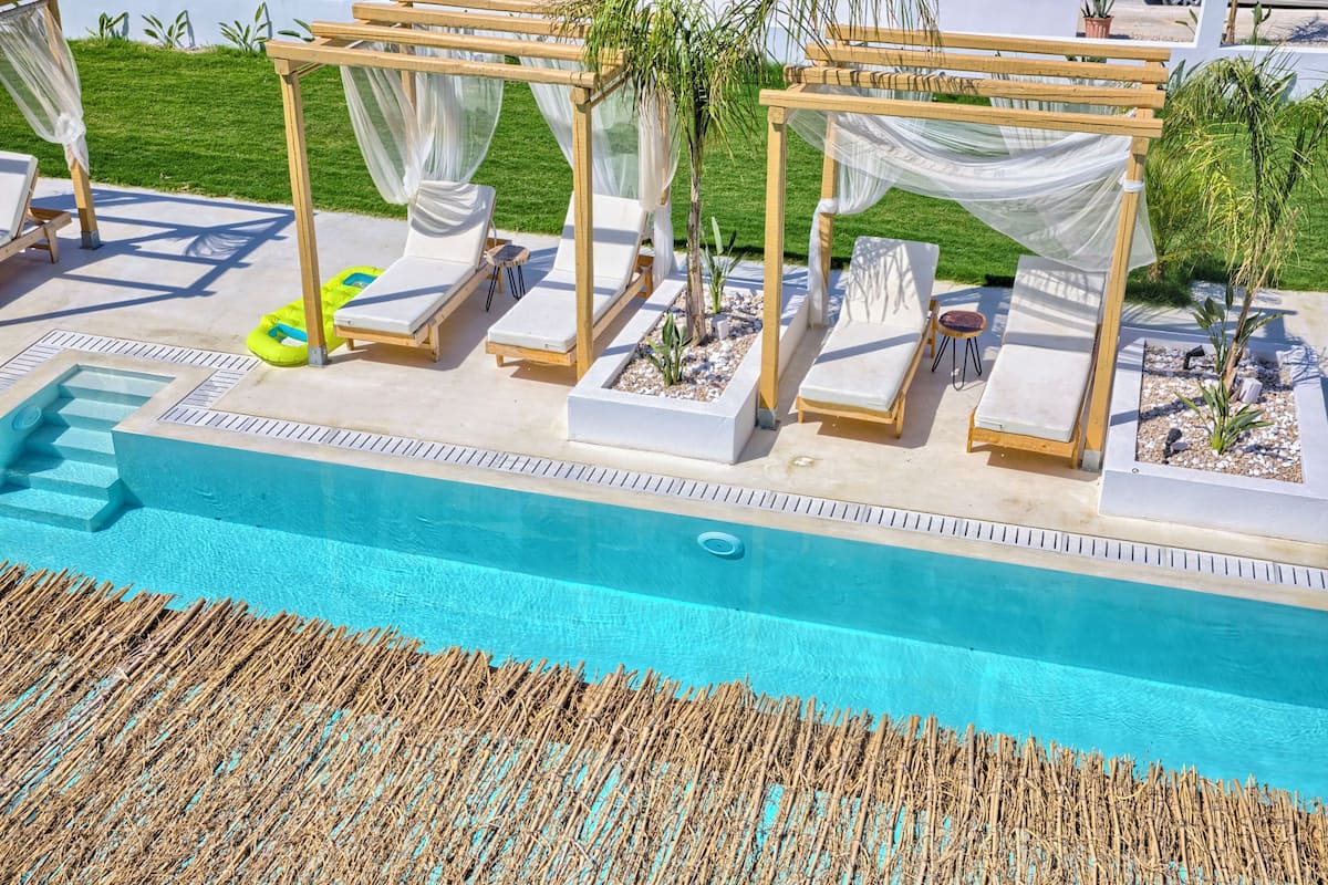 Junior Suite, Balcony, Pool View | In-room safe, desk, soundproofing, free WiFi