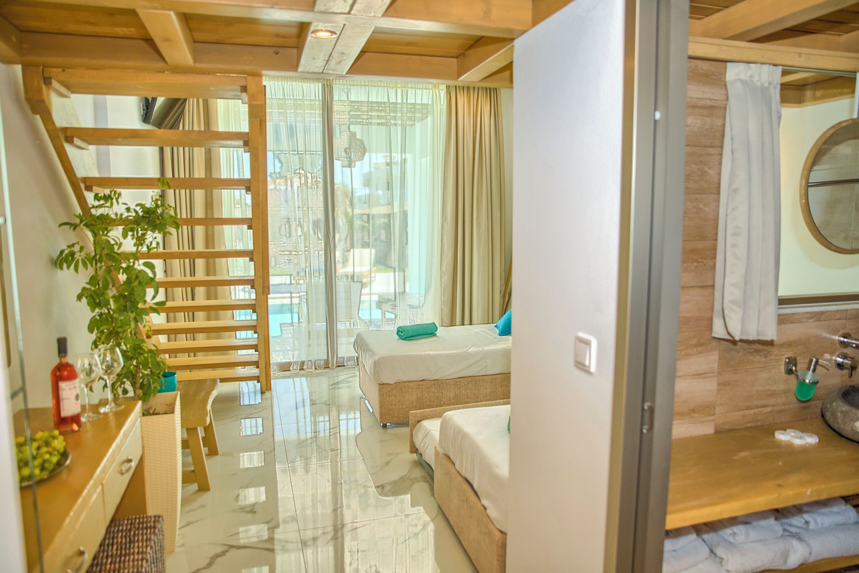Deluxe Suite, Balcony, Pool View | In-room safe, desk, soundproofing, free WiFi
