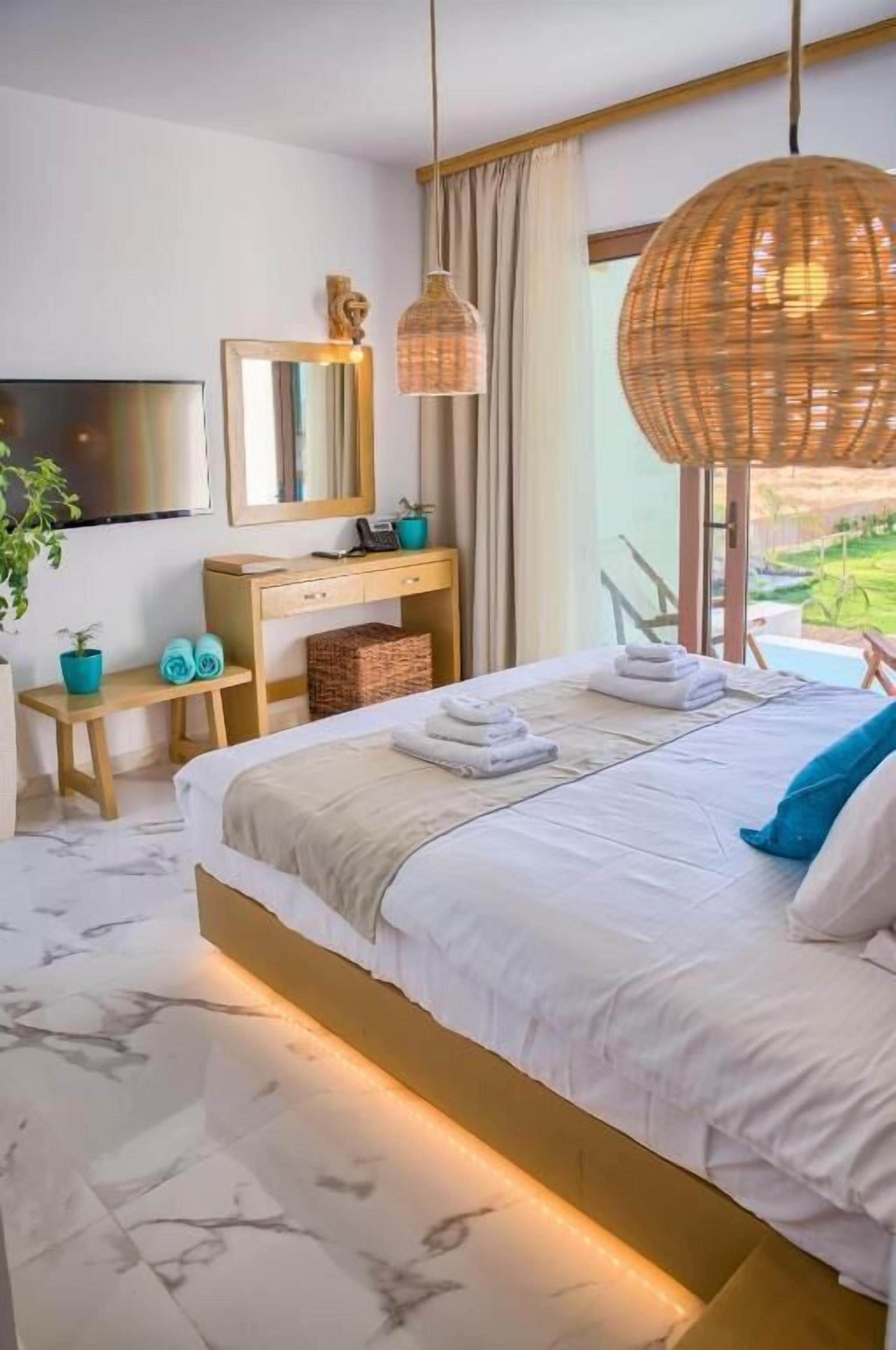 Junior Suite, Balcony, Pool View | In-room safe, desk, soundproofing, free WiFi