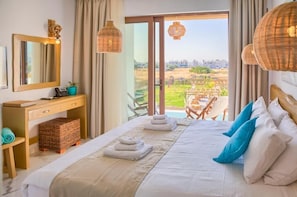 Junior Suite, Balcony, Pool View | In-room safe, desk, soundproofing, free WiFi