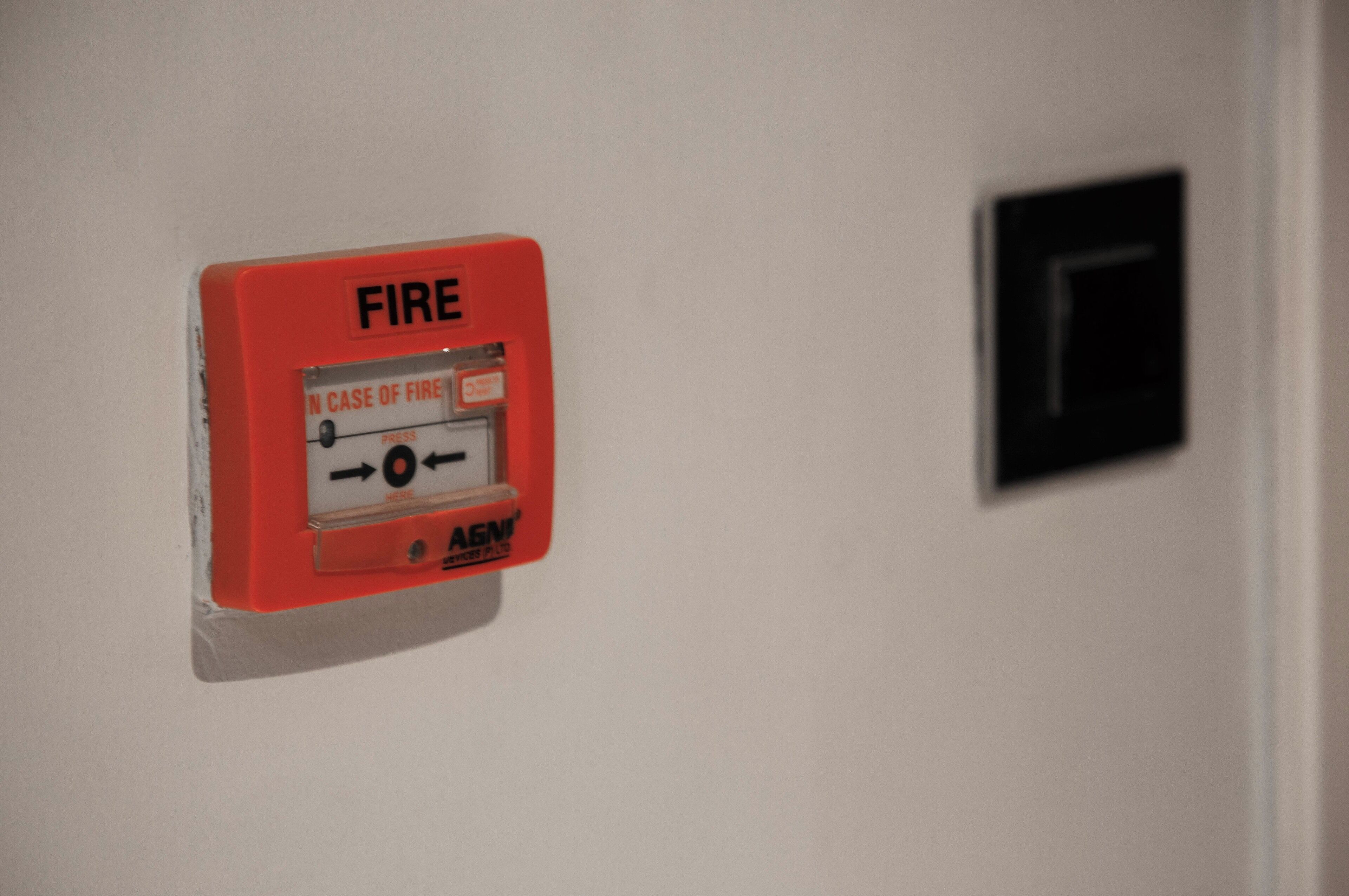 A fire alarm control panel mounted on a wall.