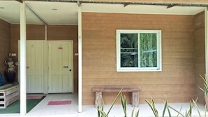 A wooden exterior with a bench, a door, and a window. - Ingna Resort (Chanuman)