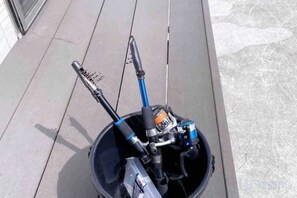 A scooter with a blue handlebar and a black seat, parked on a concrete surface. - ZZOKIAI Blue Fish! Only 2 mins to beach by walk! Maximun 11 persons! (Itoman)