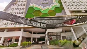 A modern hotel entrance with a distinctive hexagonal mosaic design and a sign reading "The Elysia." - Legoland -3min Drive at Elysia Park @Happy Wonder Stay-8pax(max)-Pool Garden View-Kids Friendly (Iskandar Puteri)
