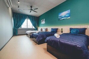 A hotel room with two beds, teal curtains, a ceiling fan, and artwork on the walls. - Austin Shoplot Grand KTV Party 3BR 9Pax Mahjong Chill (Tebrau)