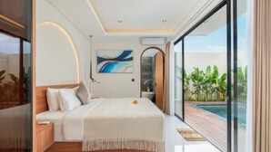 A modern bedroom with a large bed, a view of a swimming pool, and a glass door leading to a balcony. - Nidya Villa Canggu (Bali)
