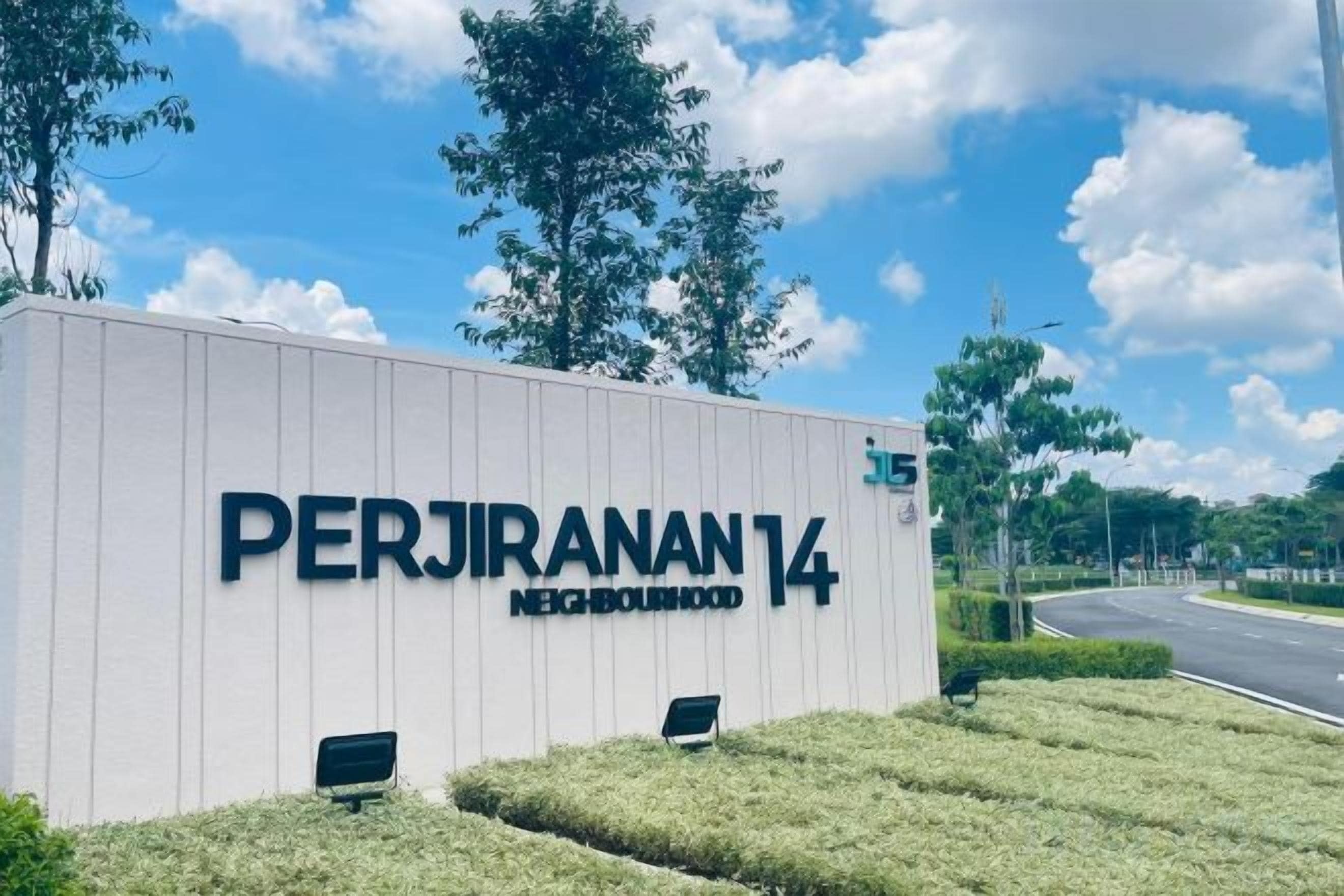 A sign for 'PERJIRANAN 14 NEIGHBORHOOD' with a clear sky and greenery in the background.