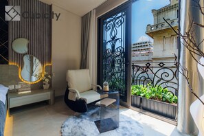 Deluxe Room, City View | In-room safe, desk, laptop workspace, iron/ironing board