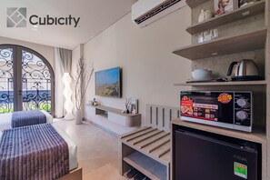 Junior Double or Twin Room, City View | In-room safe, desk, laptop workspace, iron/ironing board