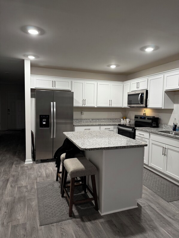 Microwave, oven, stovetop, dishwasher - Cozy + Relaxing Newly built in 2025 3BR, 2BA Near Everything! (Wilson)