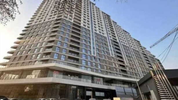 A high-rise building with multiple floors, large windows, and balconies. - White studio in Akai City,Tashkent (Tashkent)