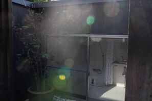 A room with a shower, a sink, and a window. - Trive Kamejima (Nagoya)