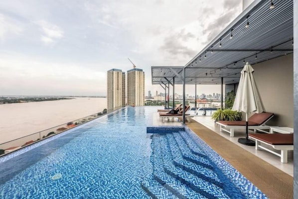Outdoor pool - Mekong View Hideaway: Cozy 1-Bedroom Retreat (Phnom Penh)
