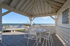 Outdoor dining - Stargazer #202 - 5 BR Oceanfront Home in the heart of Surf City, NC (Surf City)