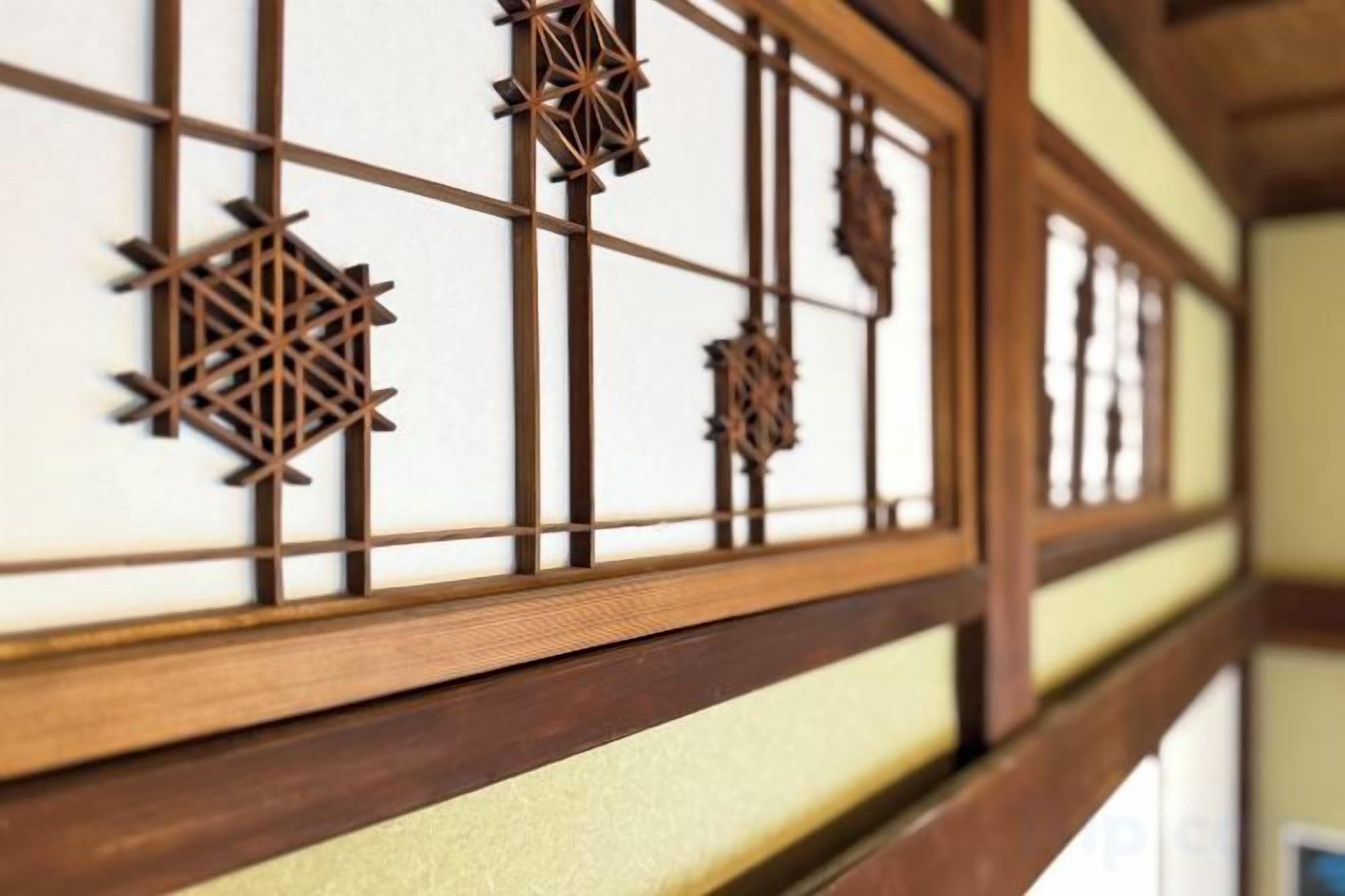A traditional Japanese shoji screen with geometric patterns.