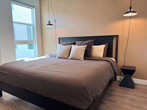 1 bedroom, desk, iron/ironing board, travel crib
