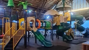 A playground with slides and climbing structures. - Sipadan Mabul Resort Semporna (Semporna)