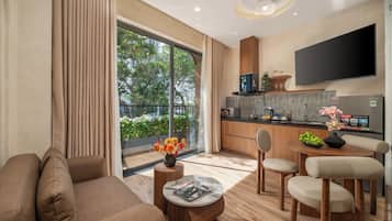 Appartement Deluxe, 1 chambre, balcon, vue ville | Salle de séjour