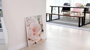 A modern dining area with a white table, black chairs, and a bench. - Hongik University Station 8min/Bedroom 3/Bed 4/Parking Available [Vanilla House] (Seoul)