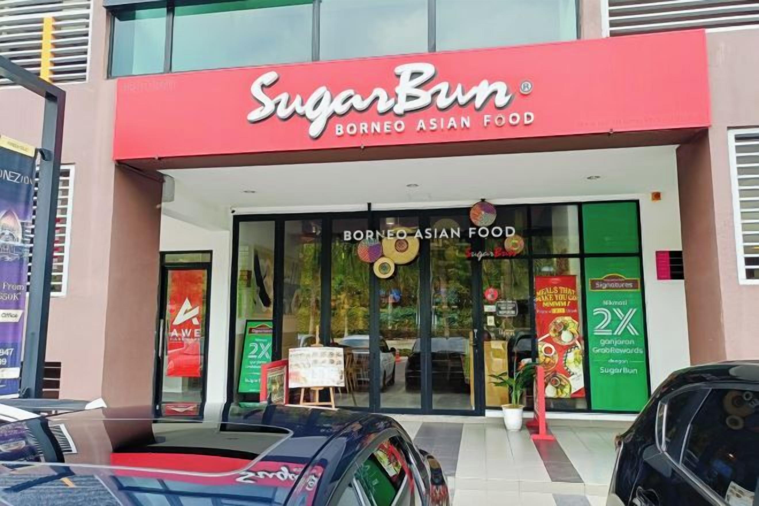 A storefront with a red awning and signage for 'Sugarbun Borneo Asian Food.'