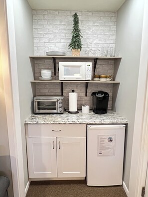 Interior - Coming for a short trip but don't want to stay in a hotel room? Stay Downhill. Comfy, cozy and the feel of home! Kitchenette stocked with essentials to make a quick meal. Extra comfortable bedding and lounging areas. <br>Walking distance to ski lift. (Boyne Falls)