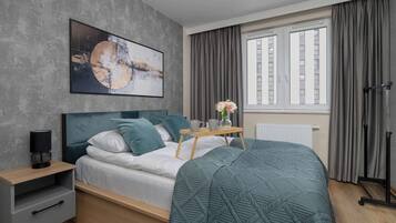 1 bedroom, desk, iron/ironing board, travel crib