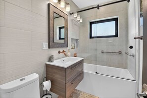 Shower, hair dryer, towels, shampoo