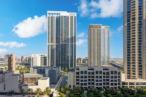 A high-rise building with multiple balconies and a clear sky. - LUX  The Creekside Skyline View Suite (Dubai)