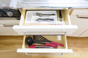 A kitchen drawer with utensils. - Dynasty 24 (Sapporo)