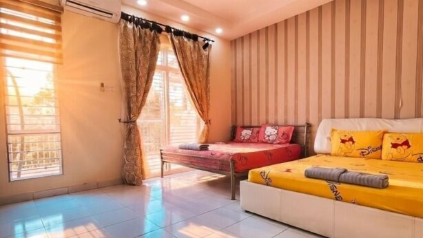 A bedroom with a bed, a window with curtains, and a striped wall. - Sekinchan Spacious 2 and Half Storey Homestay 100m Walk to KFC 7 Eleven 24hr Clinic KTV BBQ (Sekinchan)