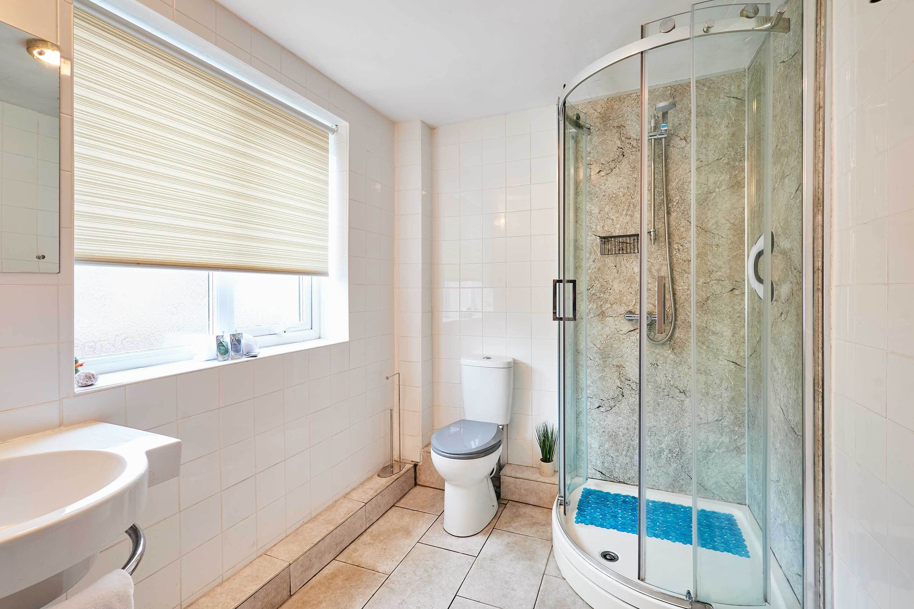 Shower, hair dryer, towels, shampoo