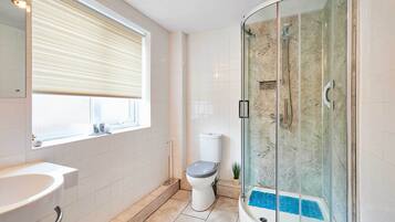 Shower, hair dryer, towels, shampoo