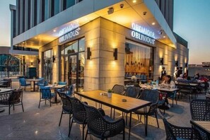 Outdoor dining - Chessboard Oasis - Elite 2BR apart by BC residence (New Cairo City)