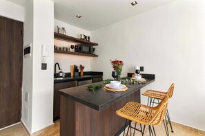 Fridge, microwave, stovetop, coffee/tea maker